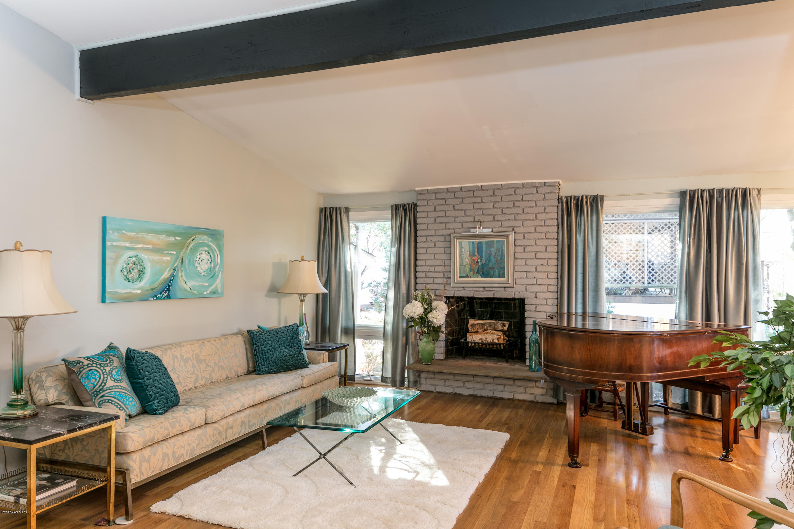 7 Crawford Terrace Riverside, CT 06878 - Photo 1 of 19 a living room with furniture a fireplace and wooden floor