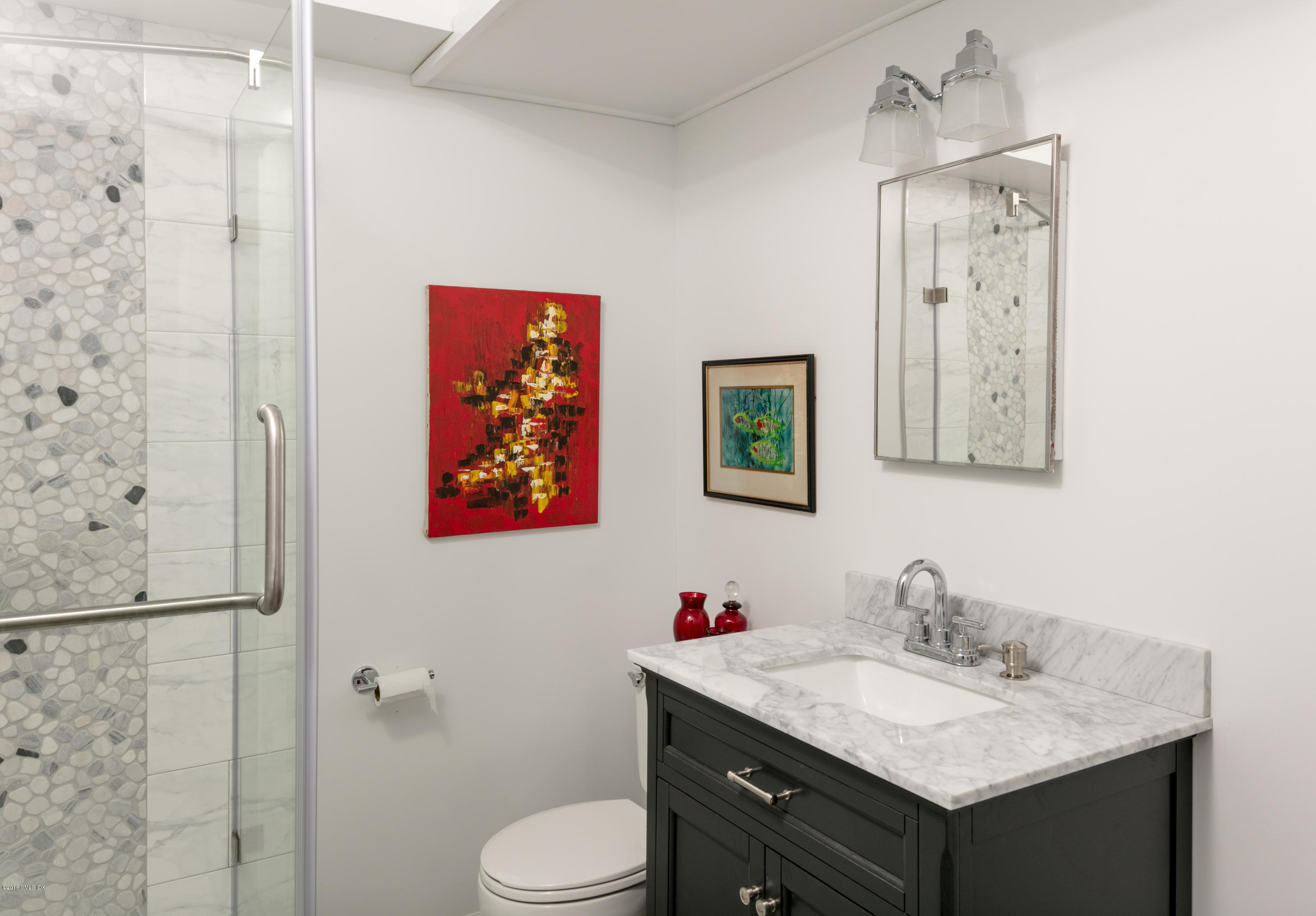 7 Crawford Terrace Riverside, CT 06878 - Photo 12 of 19 a bathroom with a granite countertop sink toilet a mirror and shower