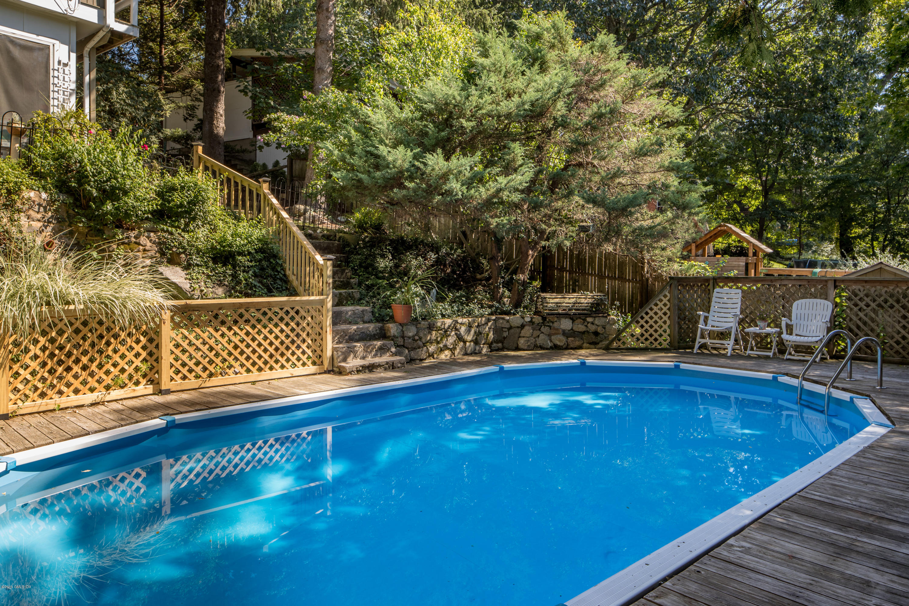 7 Crawford Terrace Riverside, CT 06878 - Photo 17 of 19 a view of a swimming pool with an outdoor seating
