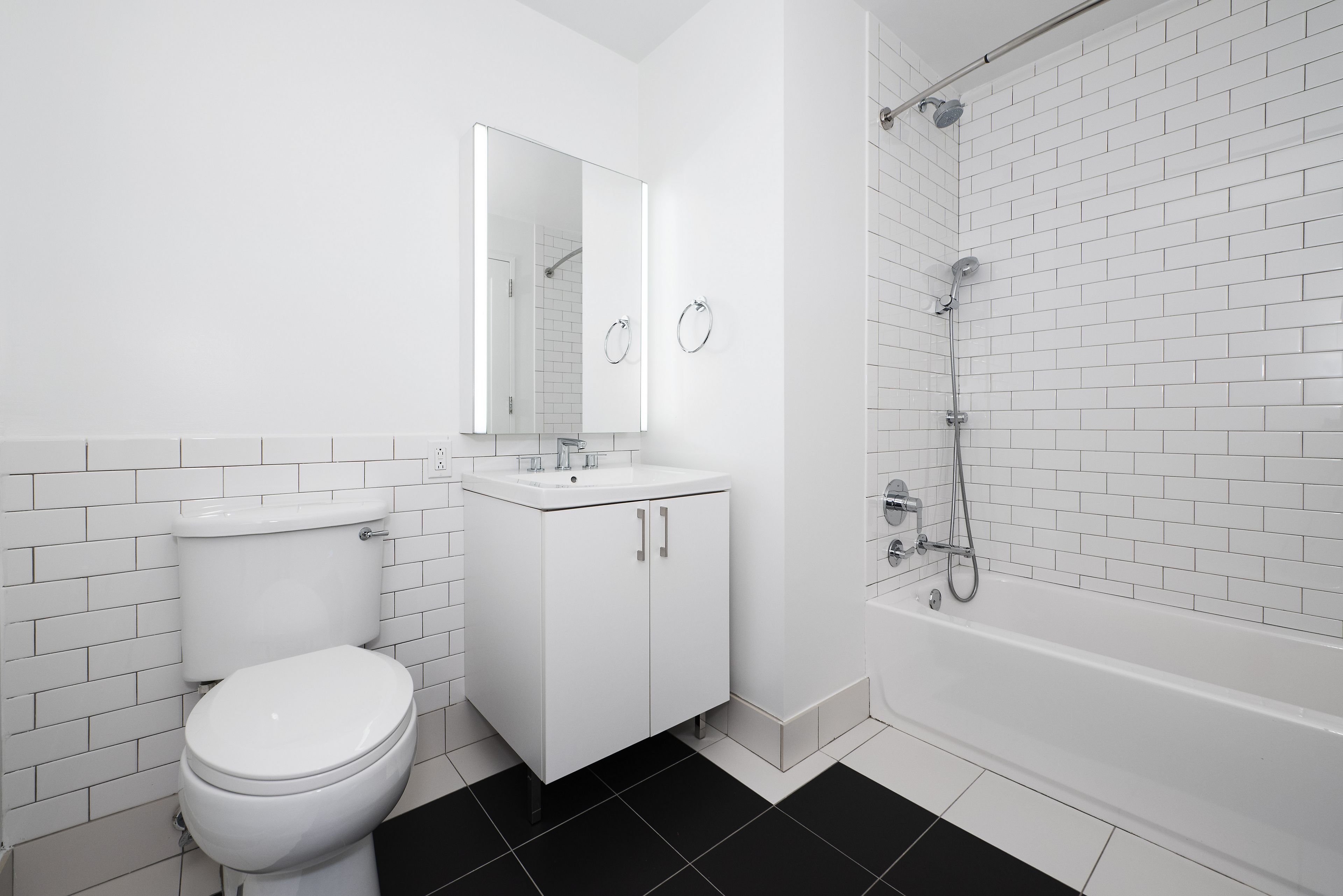 70 Pine Street, Unit 1802 Manhattan, NY 10005 - Photo 6 of 27 a bathroom with a sink toilet and shower