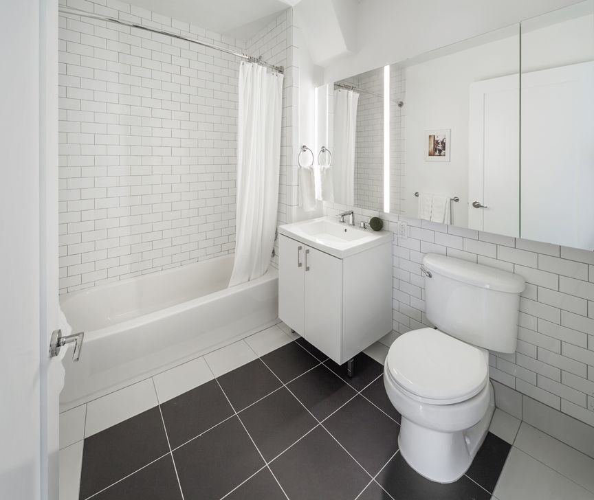 70 Pine Street, Unit 1802 Manhattan, NY 10005 - Photo 8 of 27 a bathroom with a toilet a sink and bathtub