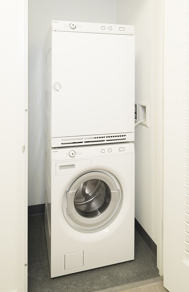 70 Pine Street, Unit 1802 Manhattan, NY 10005 - Photo 9 of 27 a utility room with dryer and washer