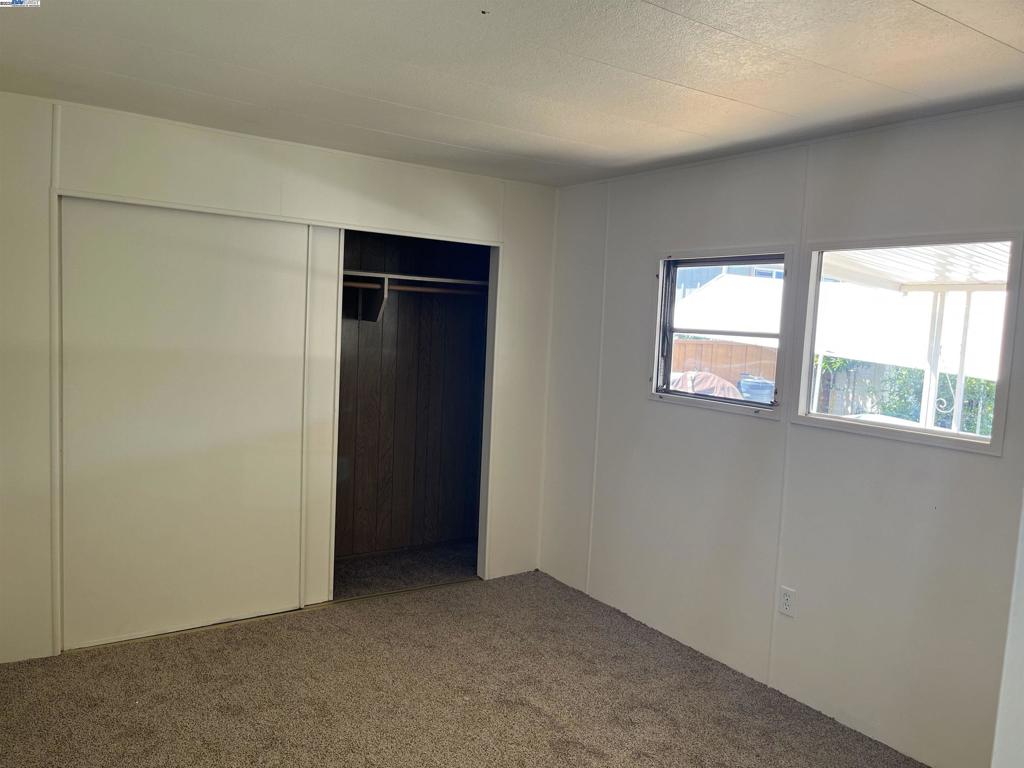 1085 Tasman Sunnyvale, CA 94089 - Photo 13 of 33 an empty room with windows and closet