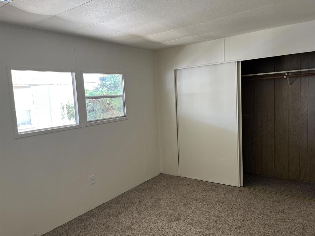 1085 Tasman Sunnyvale, CA 94089 - Photo 14 of 33 an empty room with windows and closet