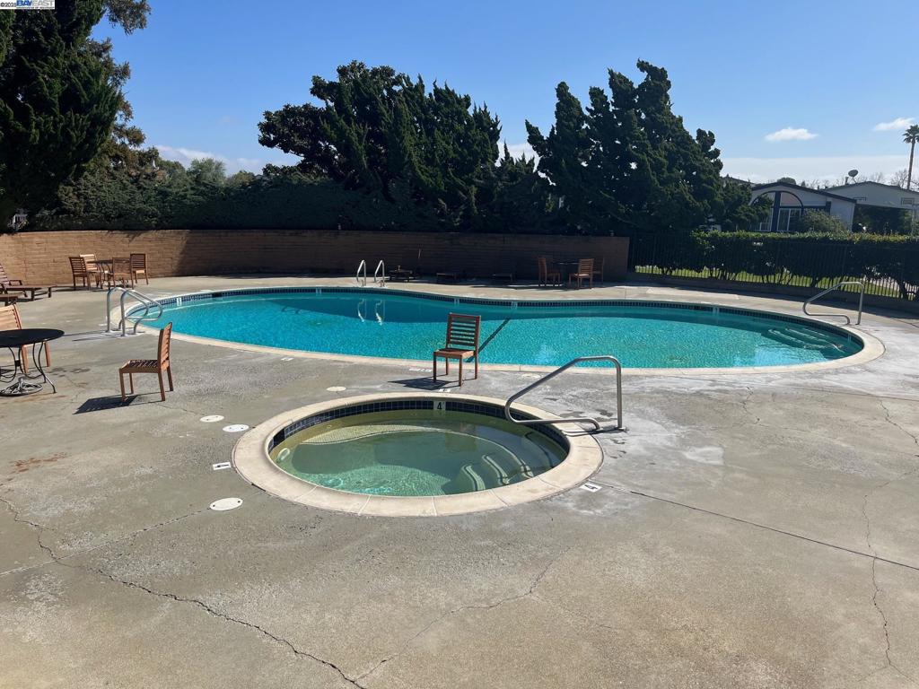 1085 Tasman Sunnyvale, CA 94089 - Photo 31 of 33 a view of a swimming pool and a yard