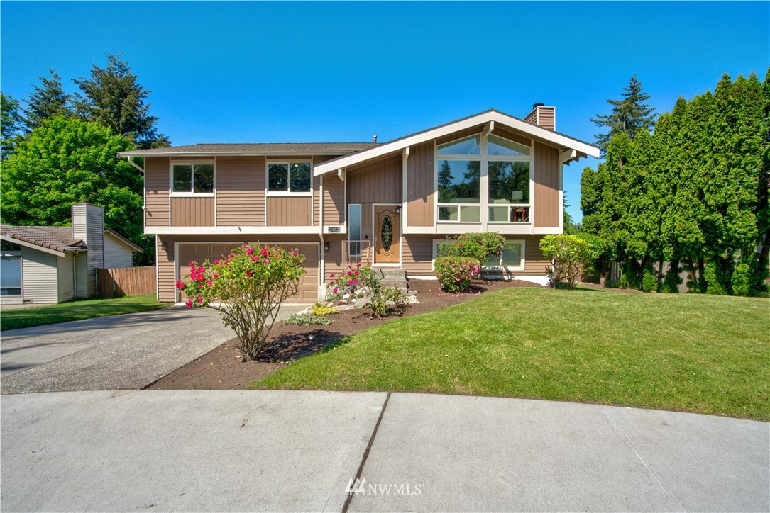 2103 Southeast 21st Street Renton, WA 98055 - Photo 1 of 23 front view of house with a yard
