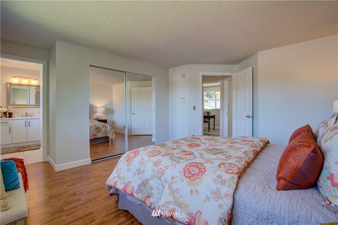 2103 Southeast 21st Street Renton, WA 98055 - Photo 13 of 23 a bedroom with a bed and wooden floor