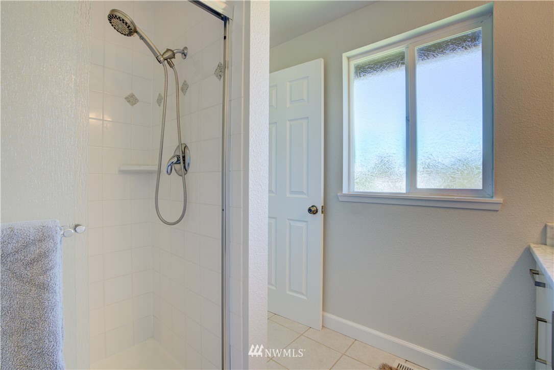 2103 Southeast 21st Street Renton, WA 98055 - Photo 15 of 23 a bathroom with a shower