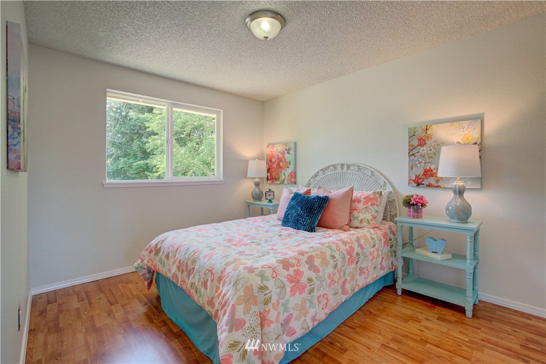 2103 Southeast 21st Street Renton, WA 98055 - Photo 16 of 23 a bedroom with a bed and a window