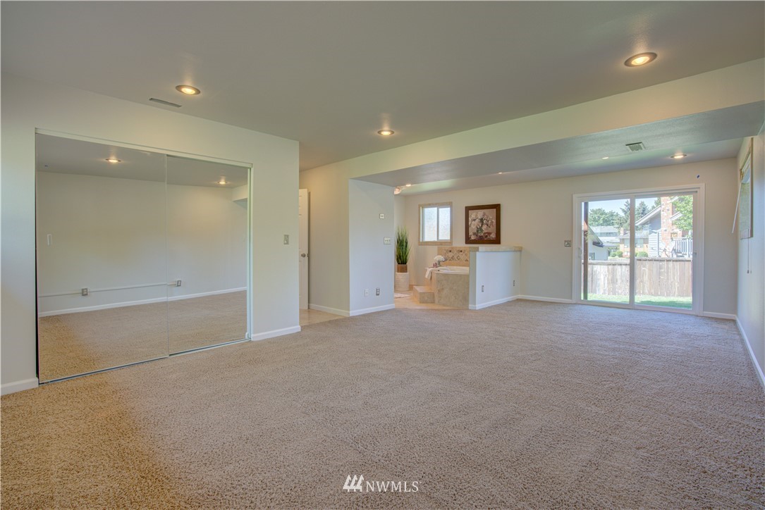 2103 Southeast 21st Street Renton, WA 98055 - Photo 19 of 23 en empty room with windows and view of bathroom