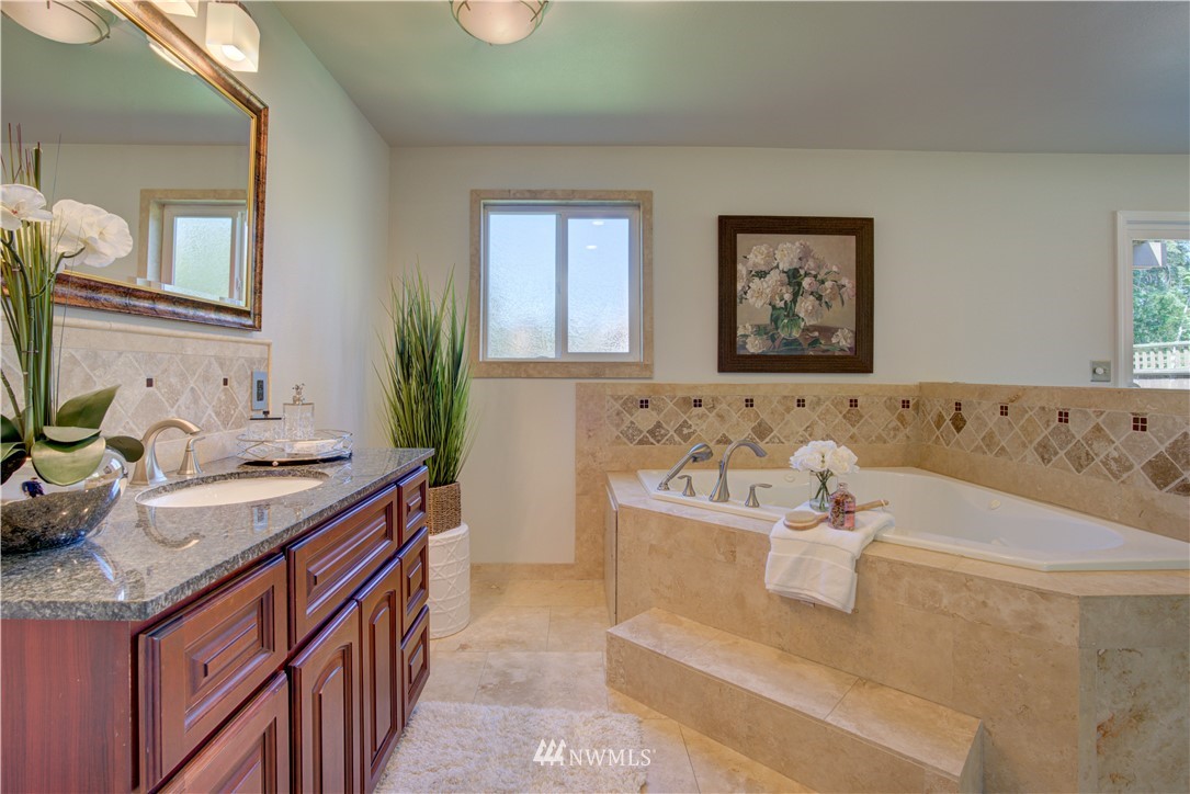 2103 Southeast 21st Street Renton, WA 98055 - Photo 20 of 23 a bath room with a sink and a mirror