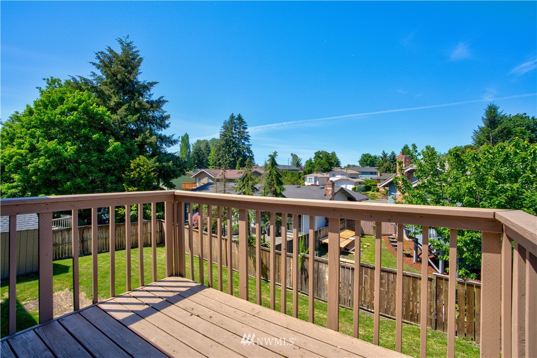 2103 Southeast 21st Street Renton, WA 98055 - Photo 22 of 23 a view of wooden deck and a yard