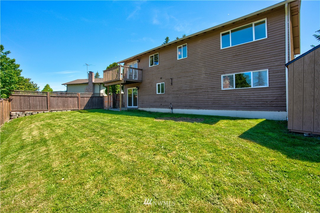 2103 Southeast 21st Street Renton, WA 98055 - Photo 23 of 23 a house that has a big yard in front of it