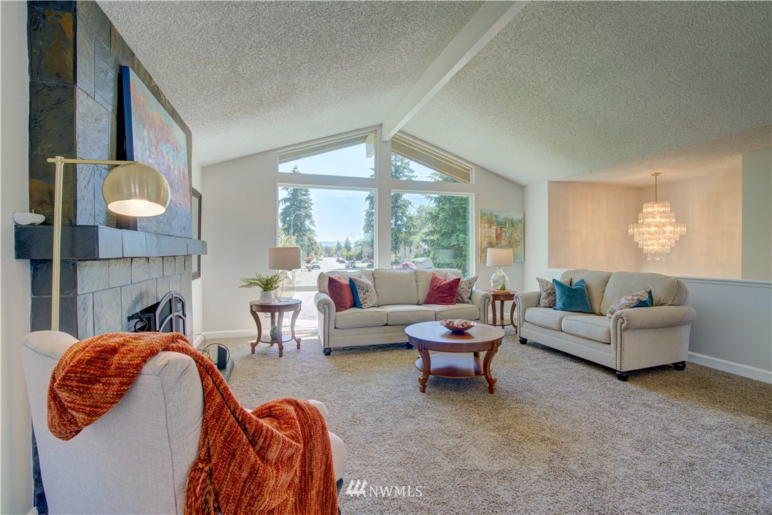 2103 Southeast 21st Street Renton, WA 98055 - Photo 5 of 23 a living room with fireplace furniture and a large window