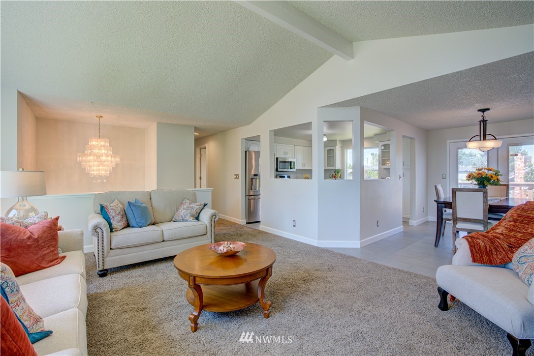 2103 Southeast 21st Street Renton, WA 98055 - Photo 6 of 23 a living room with furniture and wooden floor