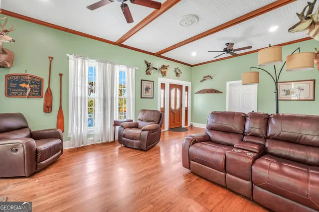 a kitchen with stainless steel appliances granite countertop a sink a stove counter space and cabinets