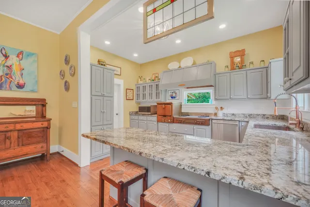 a spacious bedroom with a bed and a fireplace