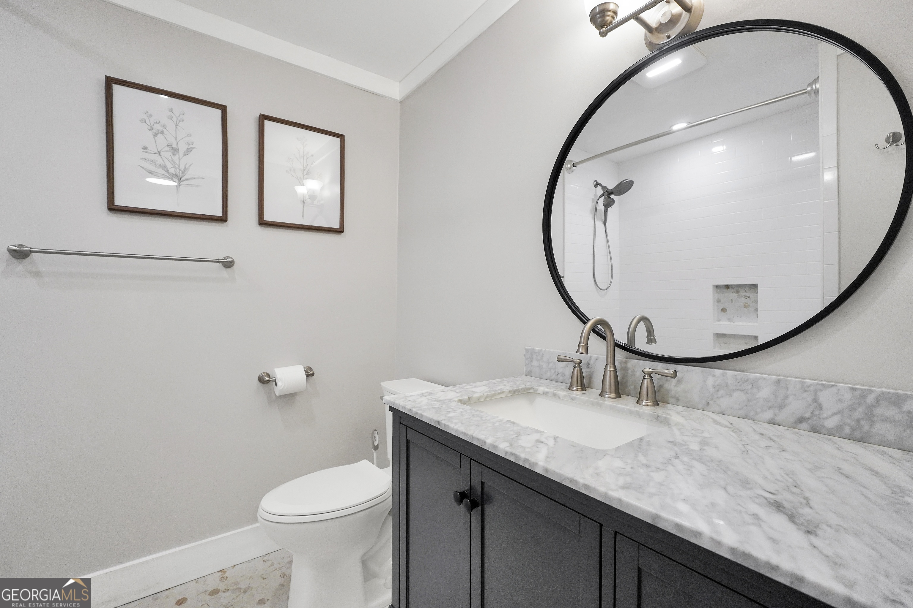 686 Burkett Road Thomaston, GA 30286 - Photo 23 of 70 a bathroom with a granite countertop toilet sink and mirror