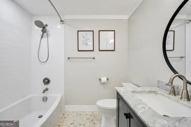 a spacious bathroom with a tub shower and mirror