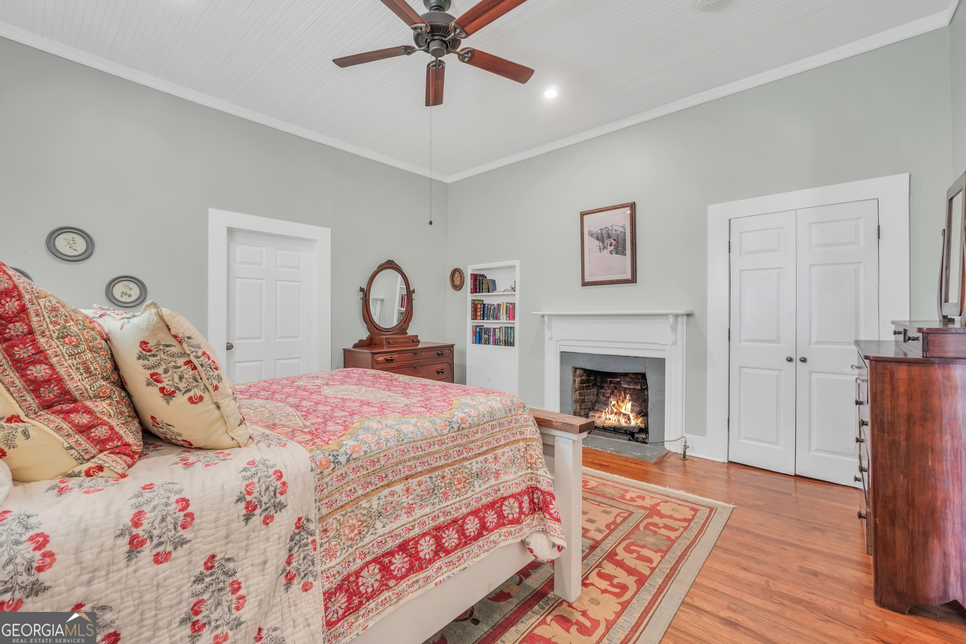 686 Burkett Road Thomaston, GA 30286 - Photo 25 of 70 a bedroom with a bed and a fireplace