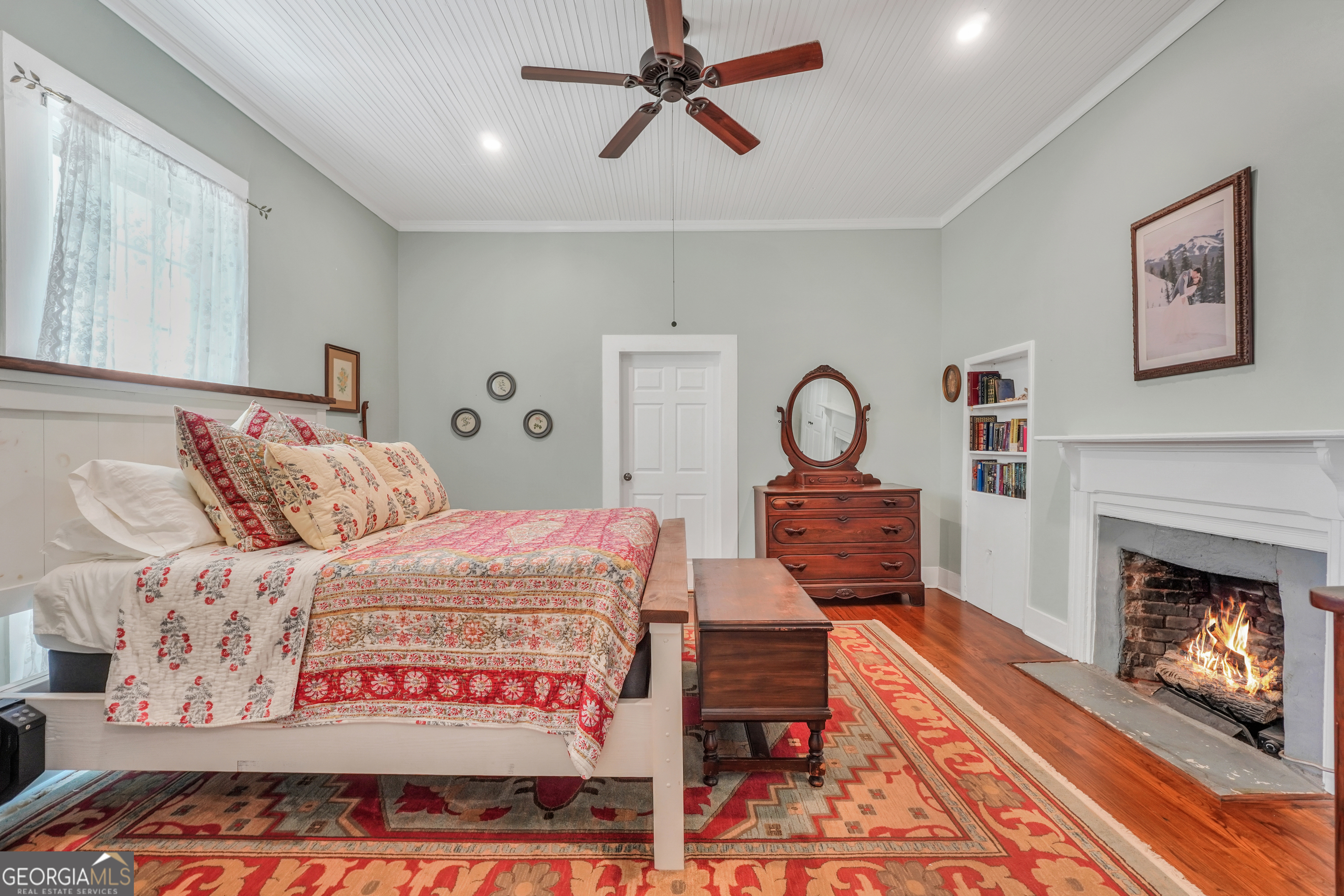 686 Burkett Road Thomaston, GA 30286 - Photo 28 of 70 a bed room with a bed and a fireplace