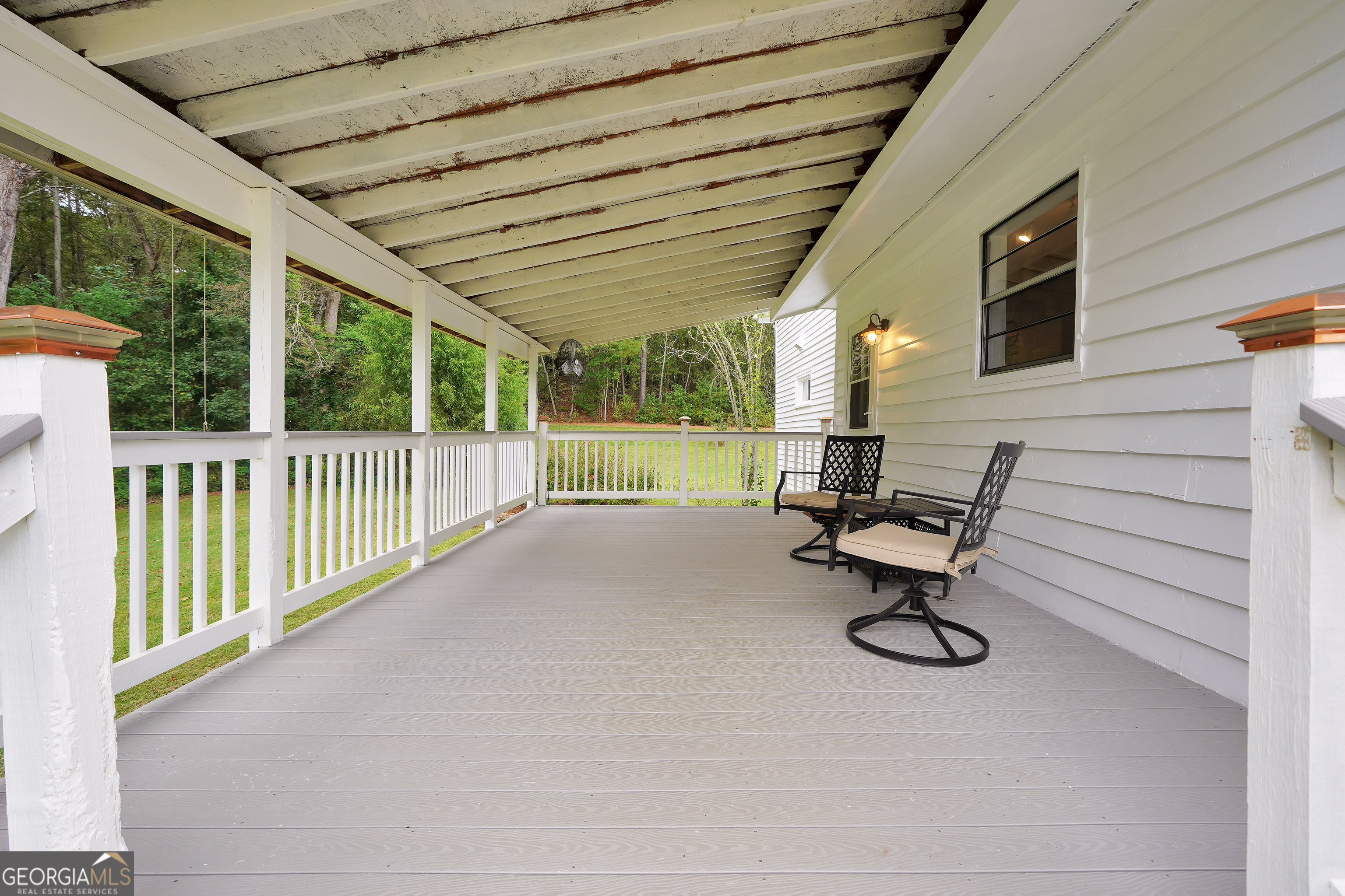 686 Burkett Road Thomaston, GA 30286 - Photo 36 of 70 a view of a patio with a table and chairs