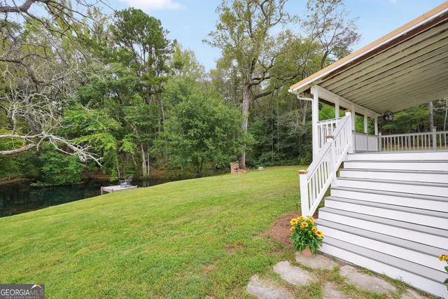 an aerial view of a house with a yard and garage