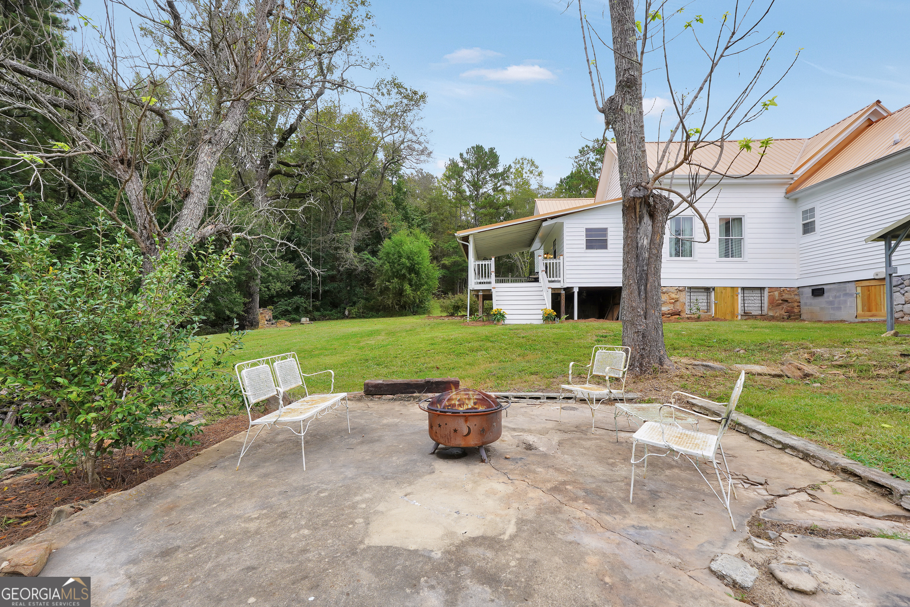 686 Burkett Road Thomaston, GA 30286 - Photo 39 of 70 a view of a house with backyard and a tree