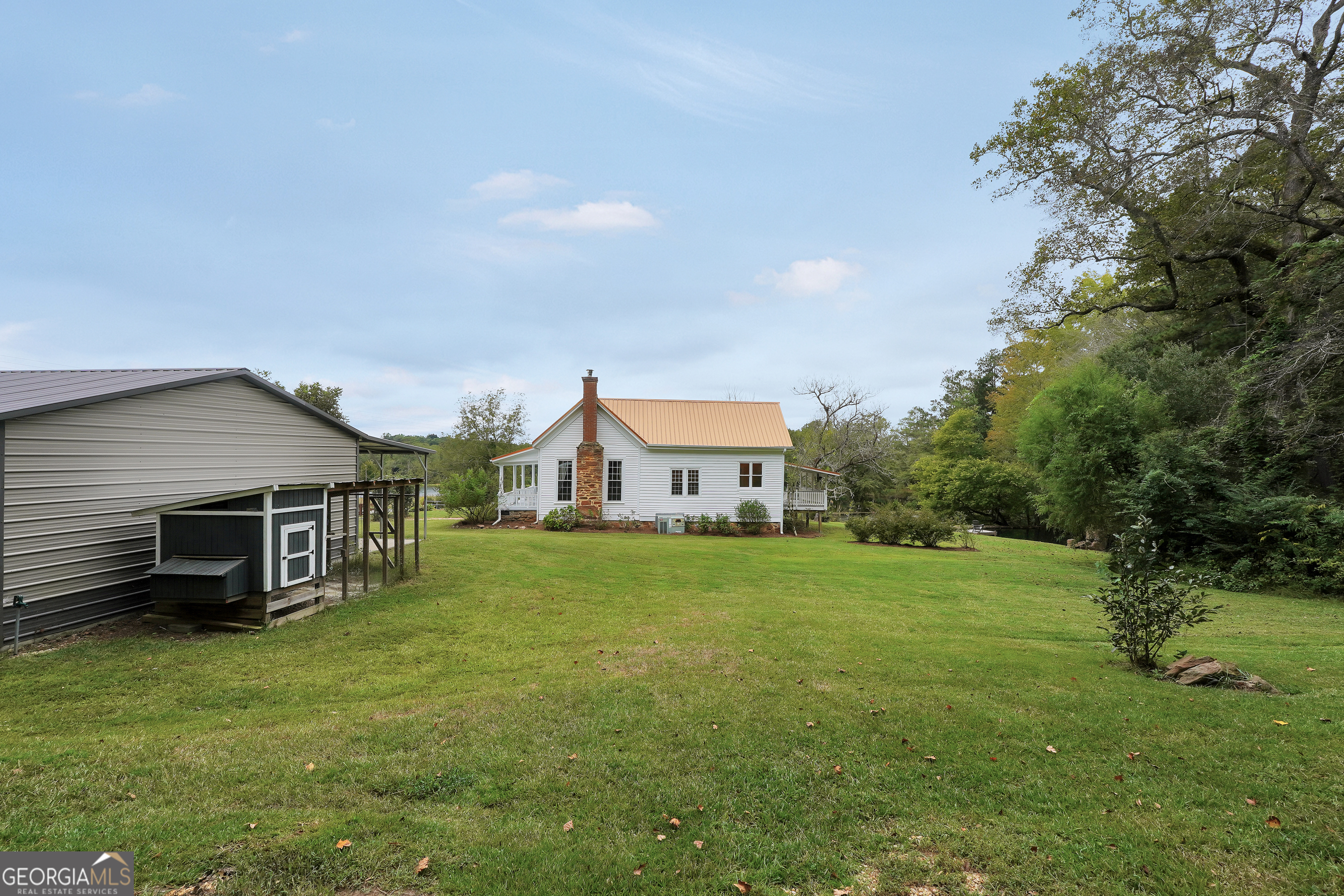 686 Burkett Road Thomaston, GA 30286 - Photo 44 of 70 a view of a house with a yard and sitting area