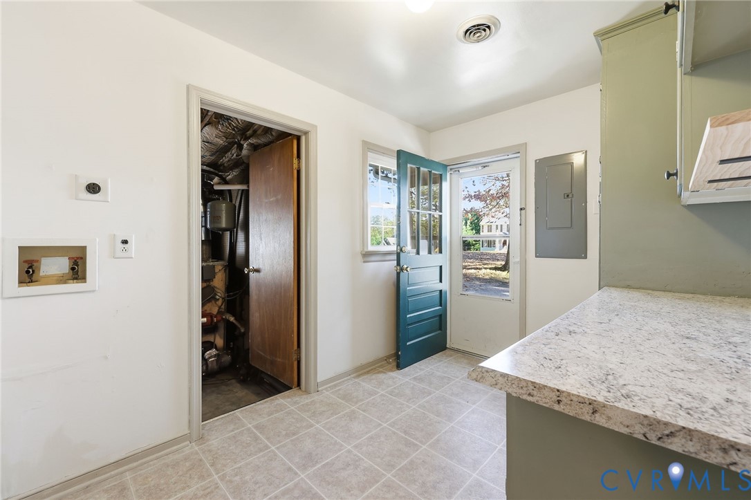 12673 Winfree Street Chester, VA 23831 - Photo 15 of 31 a kitchen with stainless steel appliances granite countertop a refrigerator and a sink