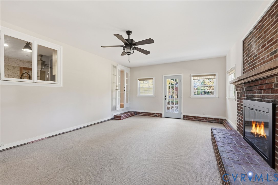 12673 Winfree Street Chester, VA 23831 - Photo 23 of 31 a view of an empty room with a fireplace and a window