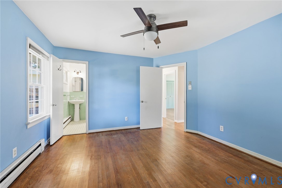 12673 Winfree Street Chester, VA 23831 - Photo 26 of 31 wooden floor in an empty room with a window