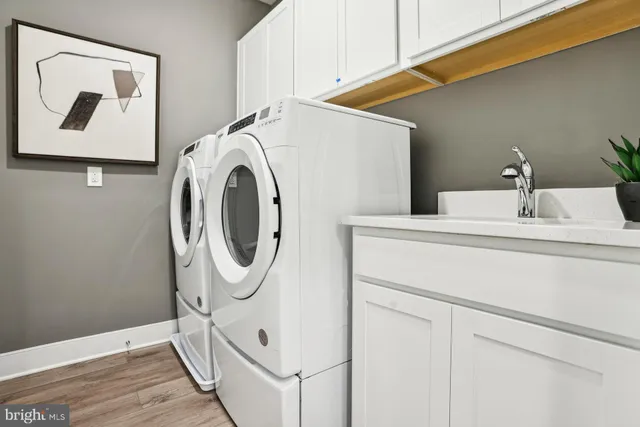 a bathroom with a shower sink and mirror