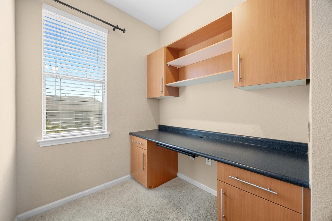 11203 Ranch Road 2222, Unit 1105 Austin, TX 78730 - Photo 16 of 35 a room with a desk and a window