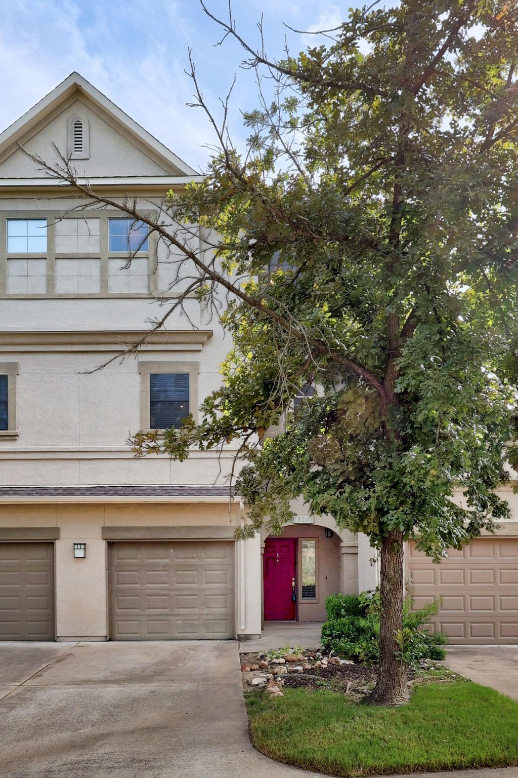11203 Ranch Road 2222, Unit 1105 Austin, TX 78730 - Photo 2 of 35 View of front of property with stucco siding, driveway, and a garage