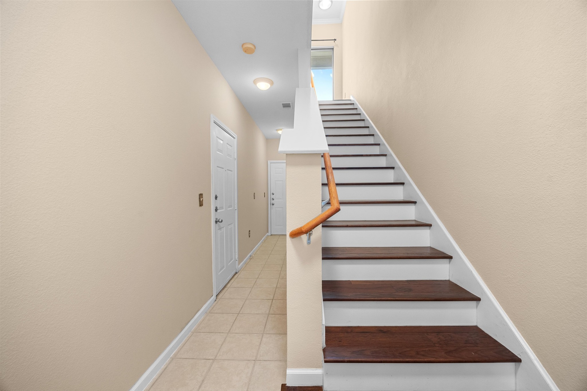 11203 Ranch Road 2222, Unit 1105 Austin, TX 78730 - Photo 22 of 35 Stairway featuring baseboards and tile patterned floors