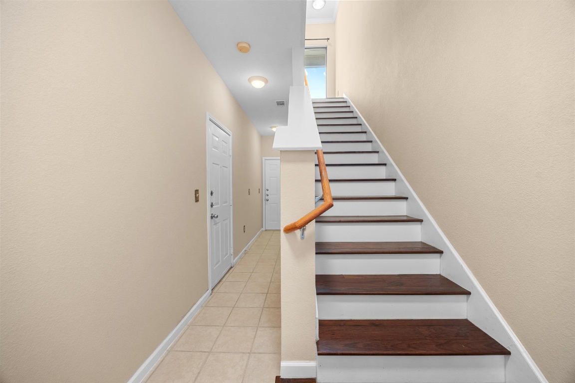 11203 Ranch Road 2222, Unit 1105 Austin, TX 78730 - Photo 22 of 35 a view of entryway and hall with wooden floor
