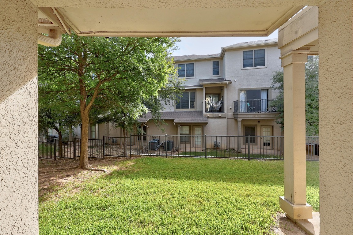 11203 Ranch Road 2222, Unit 1105 Austin, TX 78730 - Photo 28 of 35 a view of a building with a yard