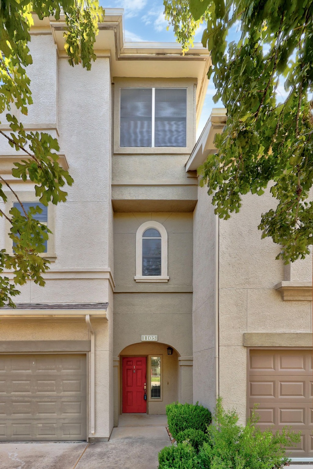 11203 Ranch Road 2222, Unit 1105 Austin, TX 78730 - Photo 3 of 35 View of front of home with stucco siding and a garage
