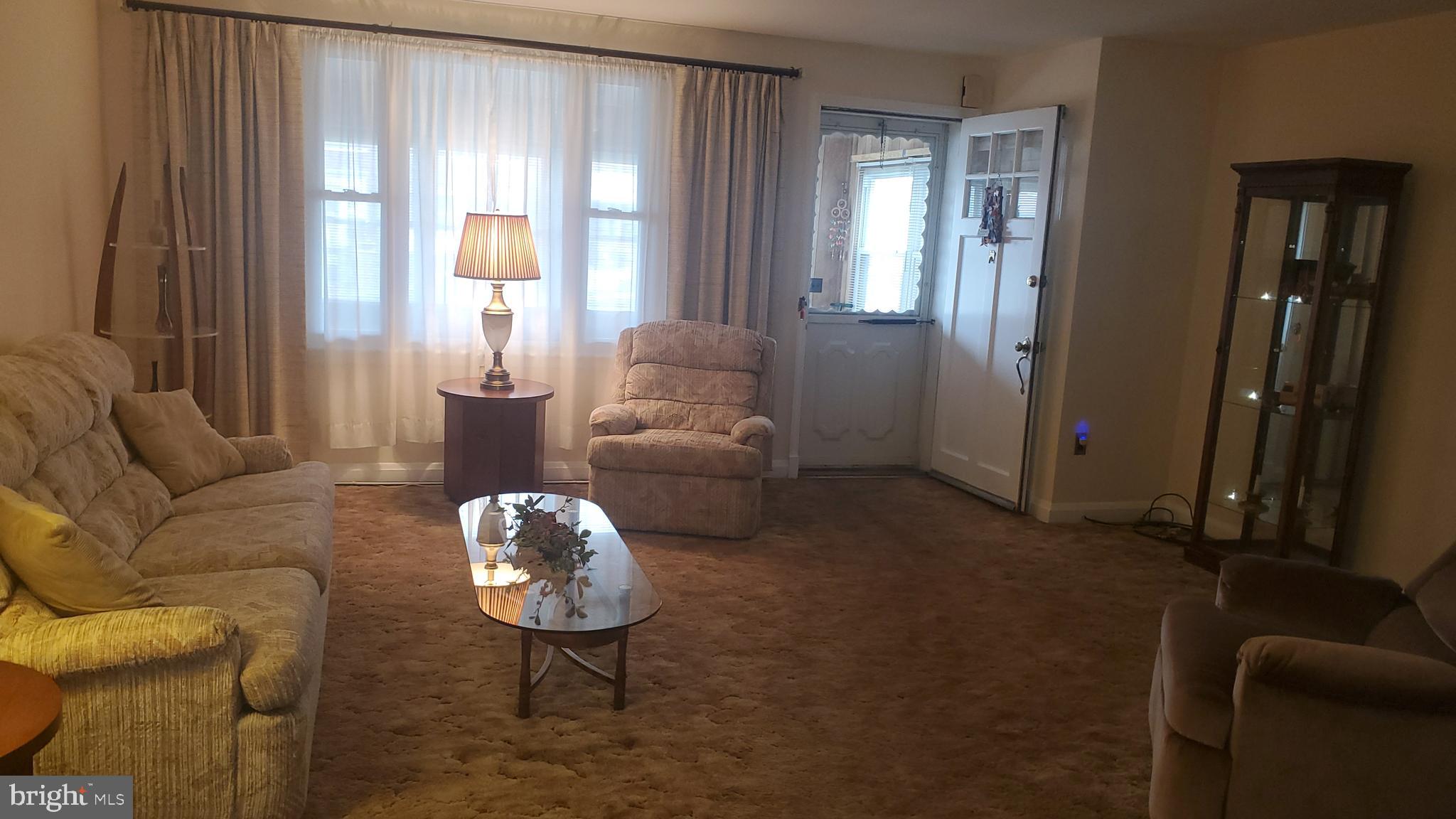 1911 Barry Road Baltimore, MD 21222 - Photo 4 of 22 Living Room- Wood Floors under carpet