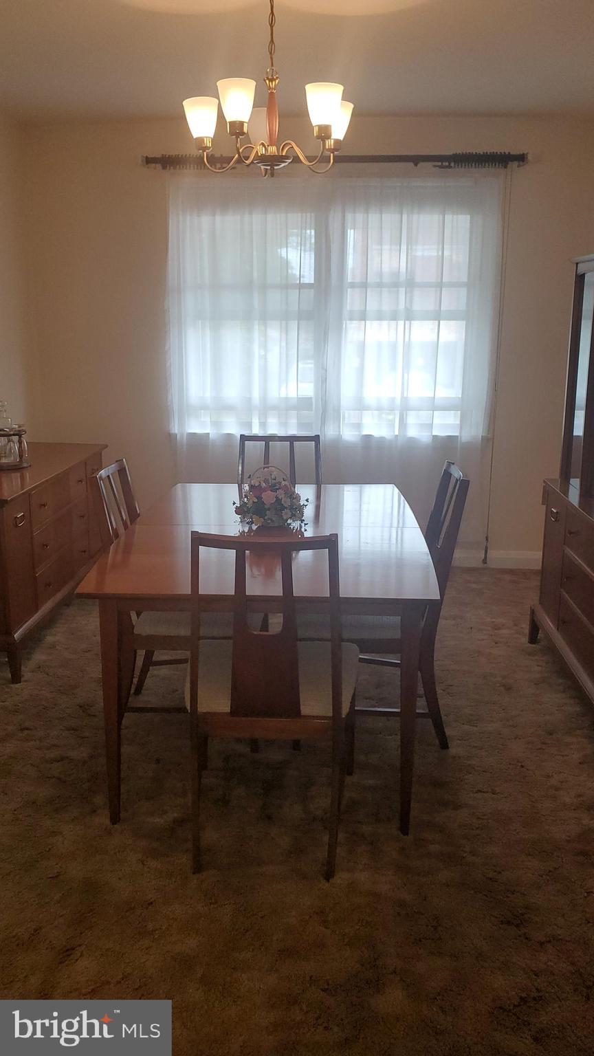 1911 Barry Road Baltimore, MD 21222 - Photo 5 of 22 Dining Room-Wood Floors under Carpet
