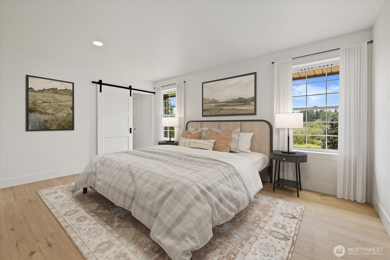 25106 47th Avenue Northeast Arlington, WA 98223 - Photo 13 of 30 a bedroom with a large bed and a window