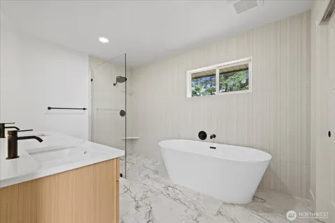 a white bath tub sitting in a bathroom