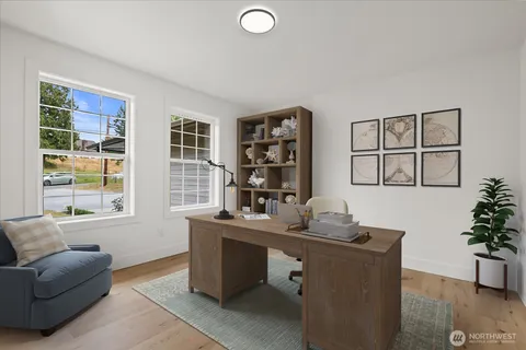 a work room with furniture and windows