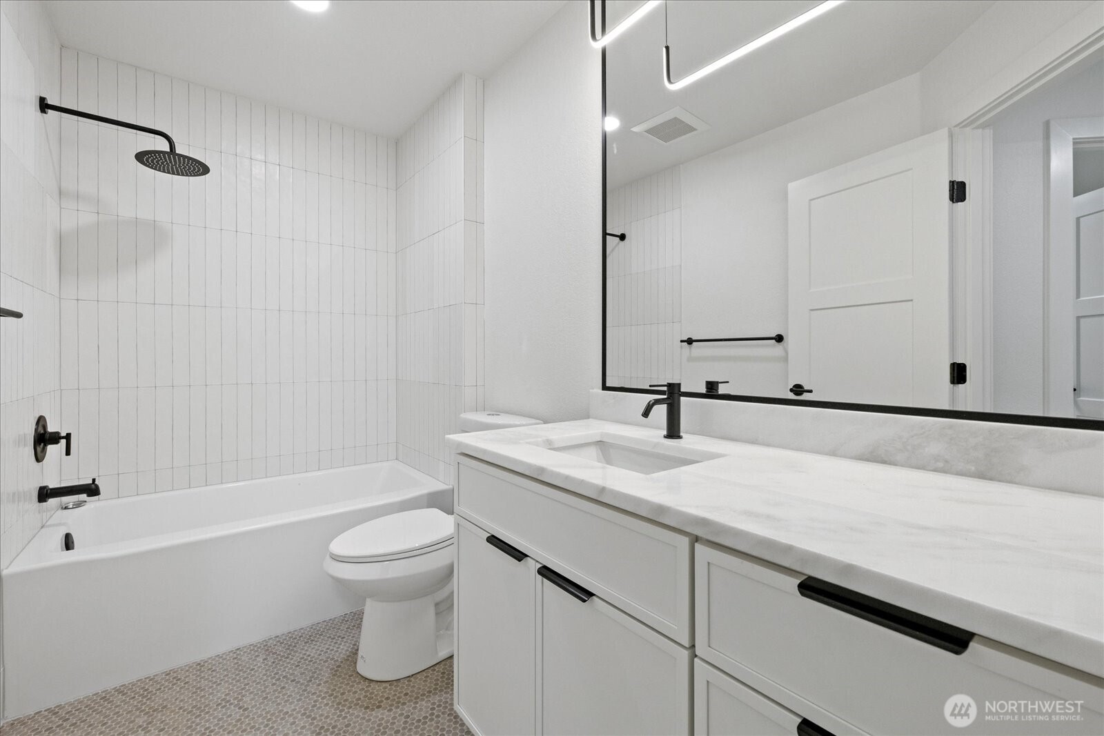 25106 47th Avenue Northeast Arlington, WA 98223 - Photo 20 of 30 a bathroom with a sink a toilet and a bathtub
