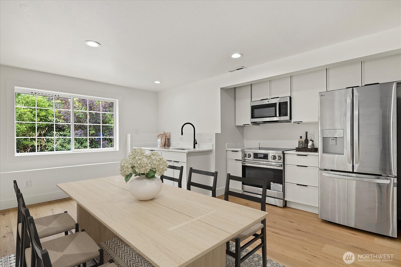 25106 47th Avenue Northeast Arlington, WA 98223 - Photo 21 of 30 a view of a dining room with furniture window and wooden floor
