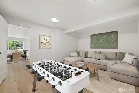 a living room with furniture a couch and a table with potted plant