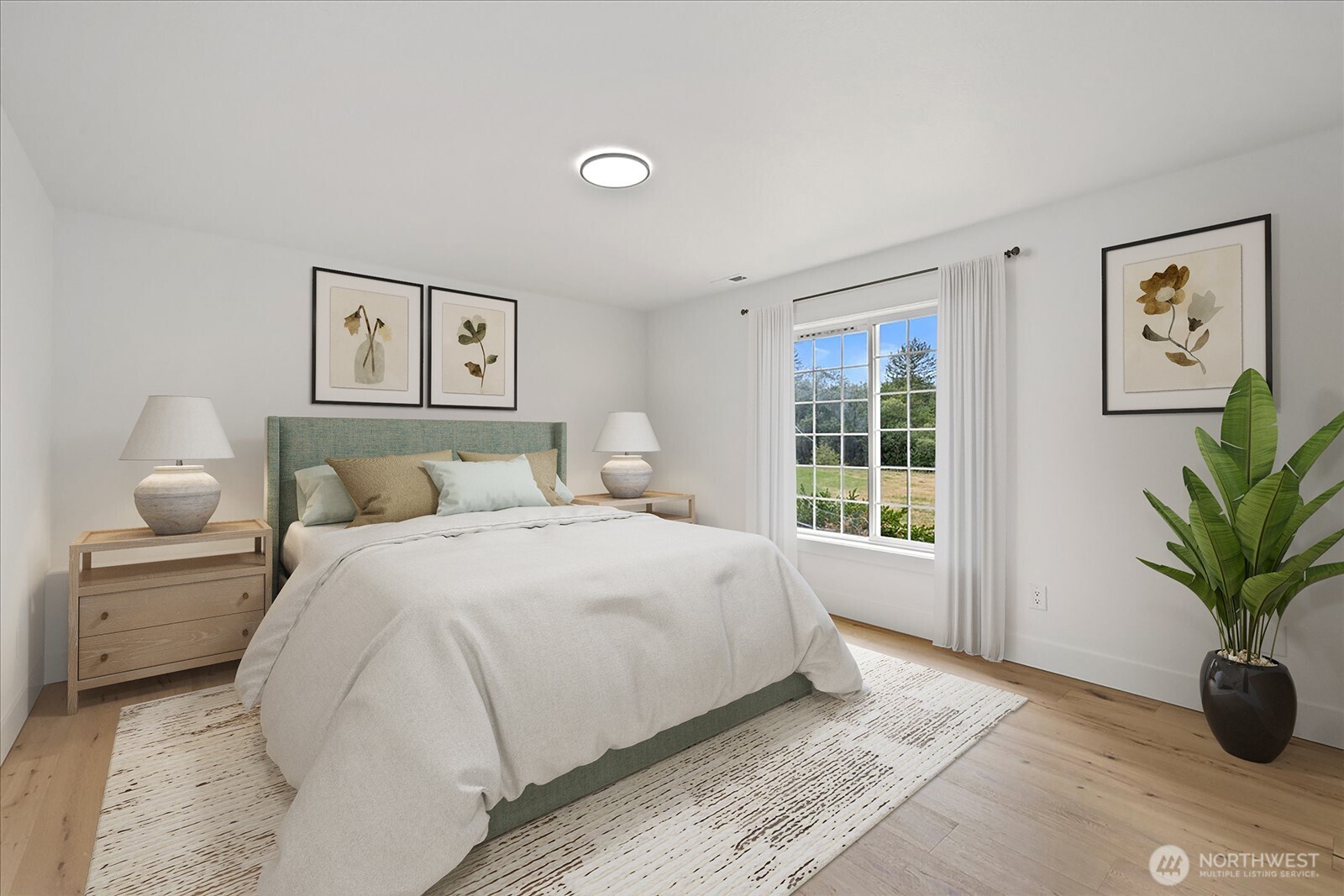 25106 47th Avenue Northeast Arlington, WA 98223 - Photo 26 of 30 a spacious bedroom with a large bed and a potted plant