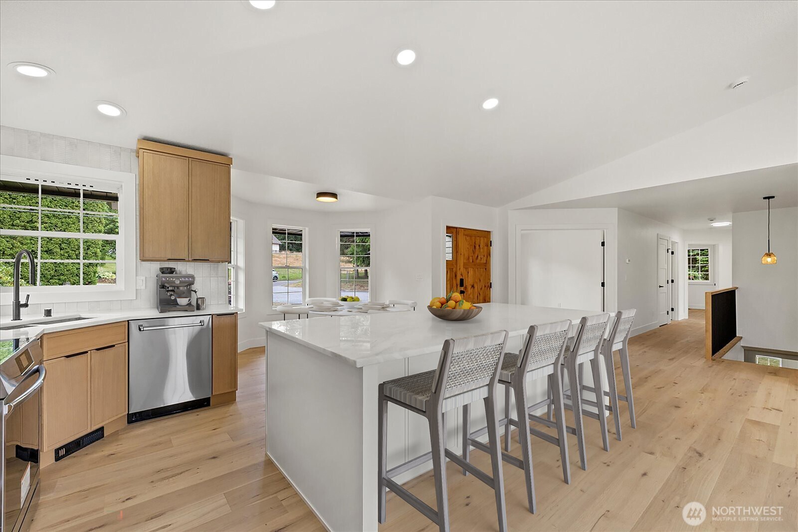 25106 47th Avenue Northeast Arlington, WA 98223 - Photo 8 of 30 a kitchen with a table chairs stove and cabinets