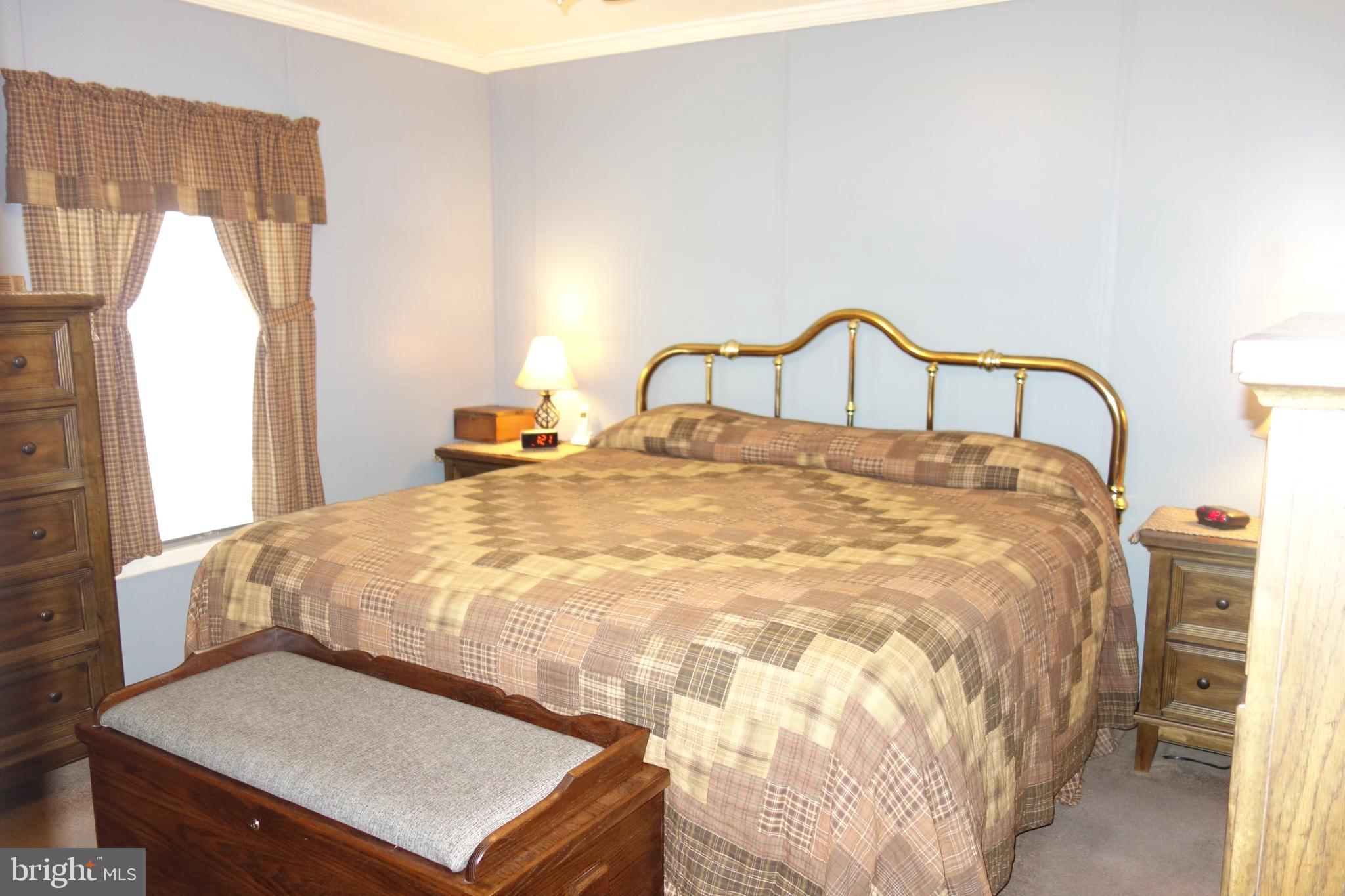 106 Circle Drive Nottingham, PA 19362 - Photo 11 of 16 a large bed sitting in a bedroom next to a window